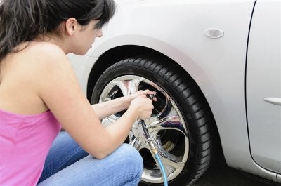 A girl makes the air in the tire in Calgary, AB